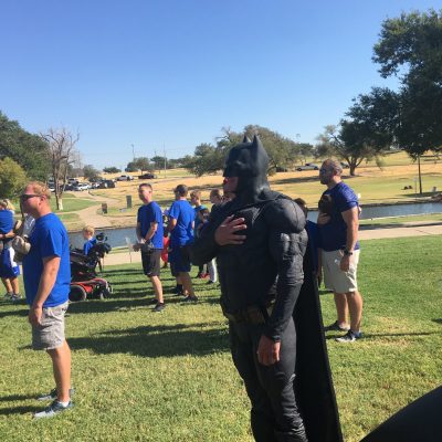 Lubbock batman listening to the national anthem